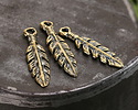 Mykonos Antique Brass (plated) Leafy Feather Charm 7x26mm