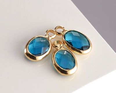 Pacific Blue Crystal Oval Drop in Gold Finish Bezel 6x8mm