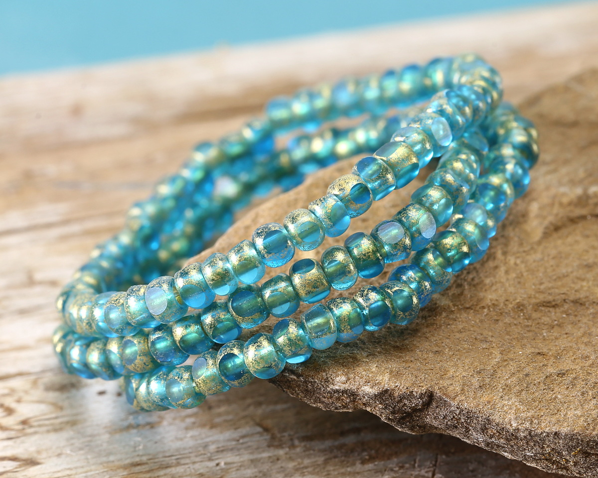 Czech Glass Aqua Blue w/ Antique Gold Trica Beads 3x4mm