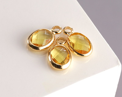 Yellow Crystal Oval Drop in Gold Finish Bezel 6x8mm