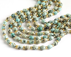 African Turquoise (A) Microfaceted Rice 6x4mm Beads